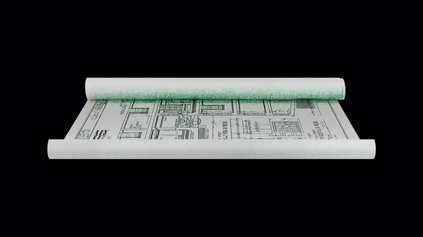 Rolled architectural blueprint placed on a white surface.