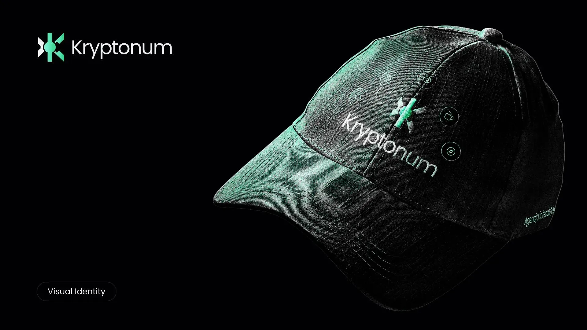 Dark cap with the Kryptonum logo lit by green light against a black backdrop.